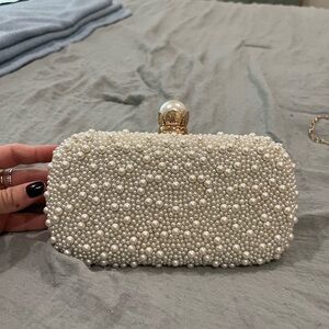Pearl covered clutch with gold glitter backside